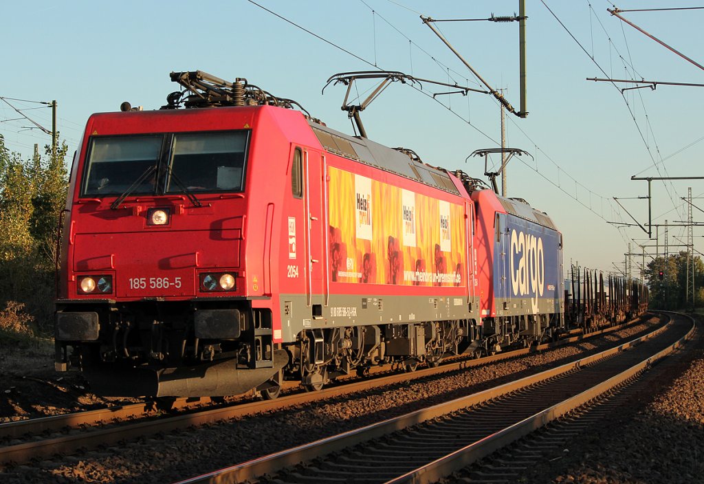 185 586-5 der HGK  Heizprofi  mit SBB Cargo 482 in Porz Wahn am 30.09.2011