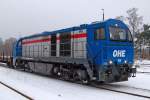 Die OHE 1028 wartet mit einen Panzerzug im Bahnhof Munster.