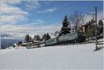 Die MOB Ge 4/4 8003 mit den recht bunten IR 2122  MOB Panoramic  aufdem weg von Montreux nach Zweisimmen bei Les Avants.